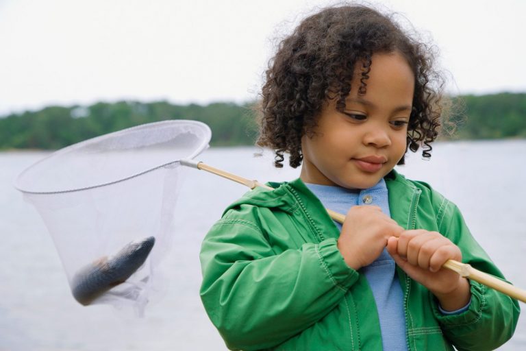 using crickets as bait child with fish in a net